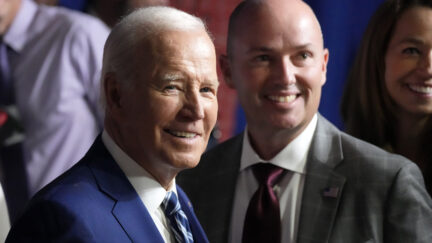 President Joe Biden smiles as he stands with Utah Gov. Spencer Cox after speaking at the George E. Wahlen Department of Veterans Affairs Medical Center, Thursday, Aug. 10, 2023, in Salt Lake City.