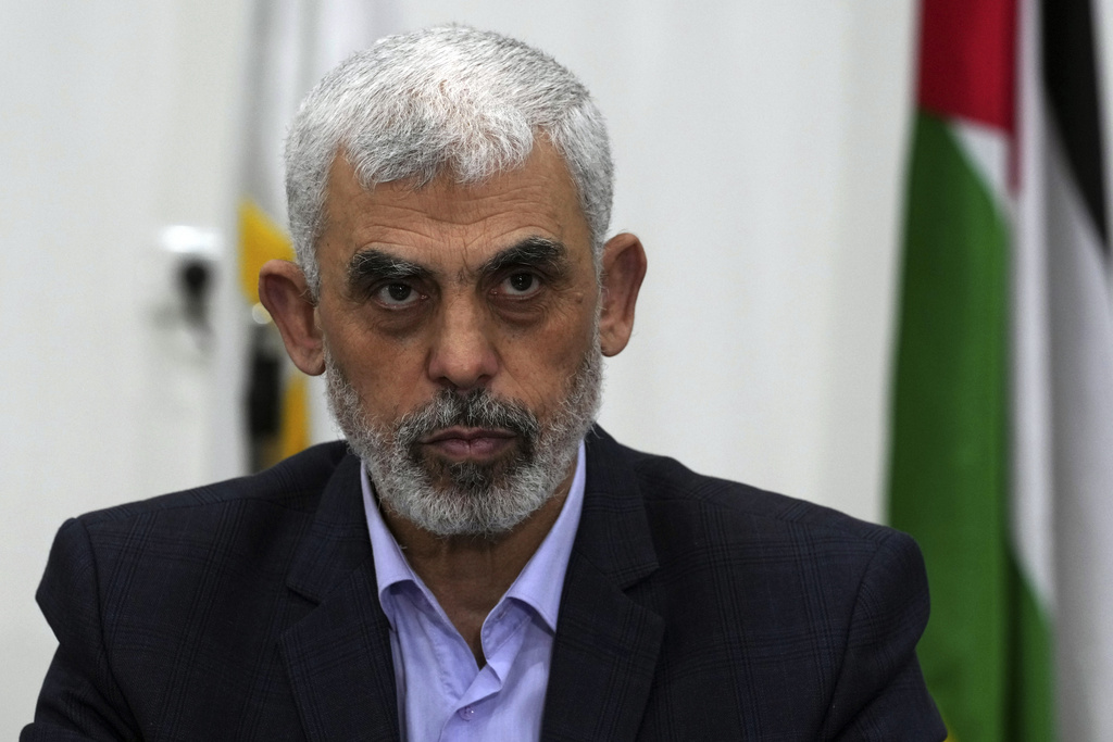 FILE - Yahya Sinwar, head of Hamas in Gaza, chairs a meeting with leaders of Palestinian factions at his office in Gaza City, Wednesday, April 13, 2022. The Hamas officials are accused by the ICC of planning and instigating eight war crimes and crimes against humanity, among them extermination, murder, taking hostages, rape and torture.